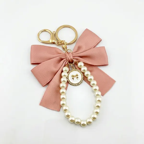 Llavero moño rosa con perlas Jinpinmao
